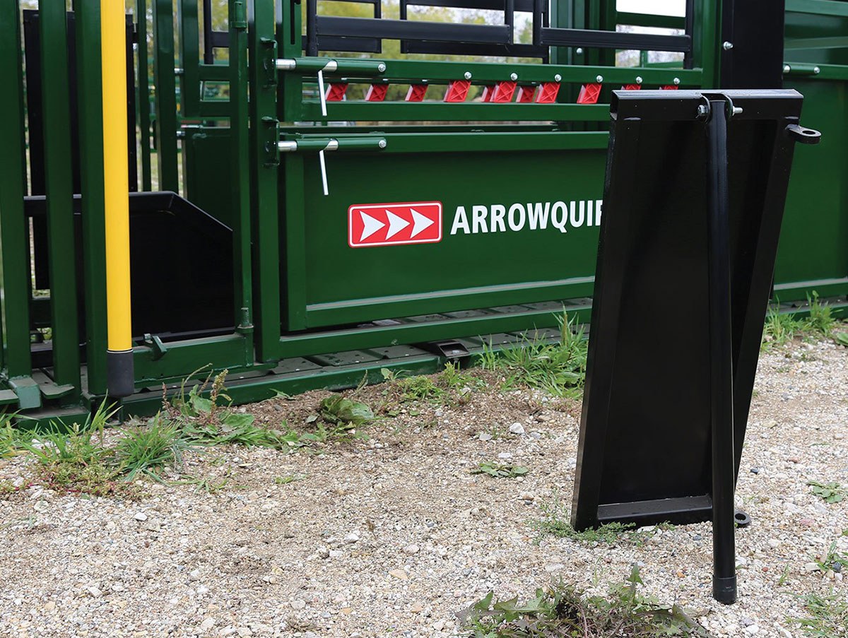 Removable neck access panels sitting beside cattle crush